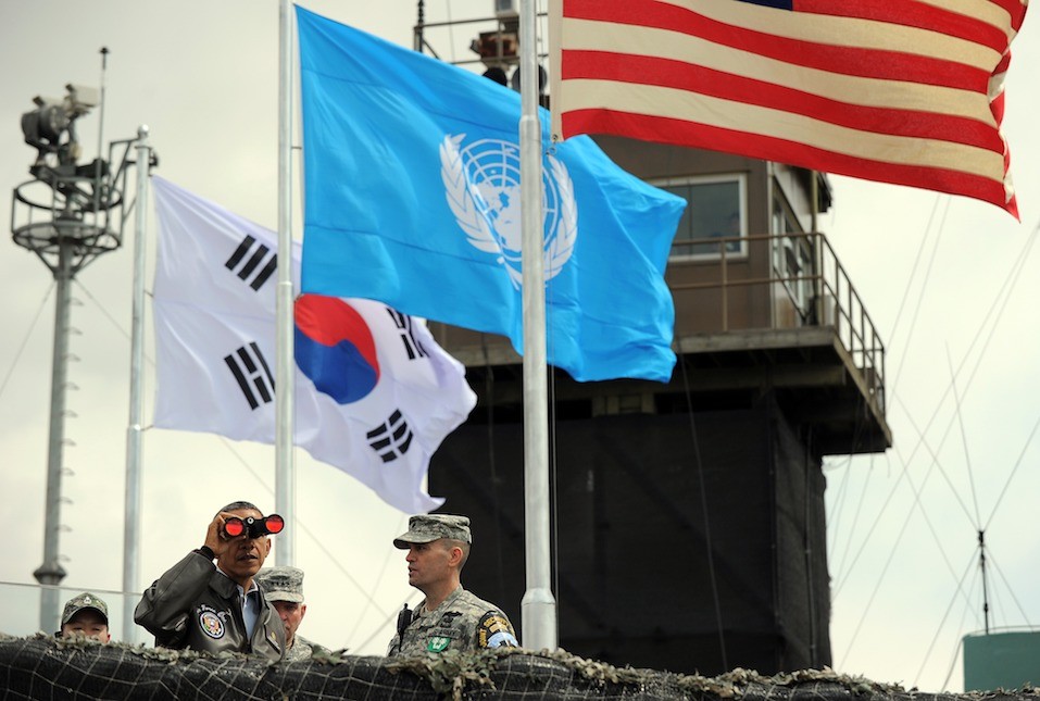 US President Barack Obama looks through binoculars towards North Korea from Observation Post Ouellette US President Barack Obama looks through binoculars towards North Korea from Observation Post Ouellette