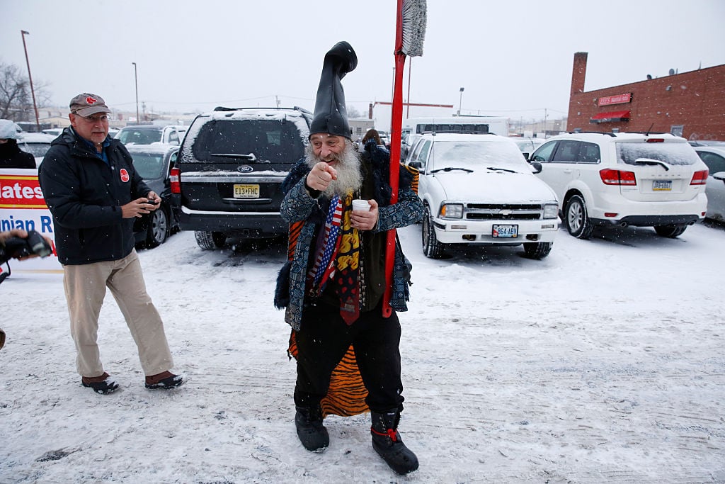 U.S. presidential candidate "Vermin Supreme" campaigns near an American Legion post.