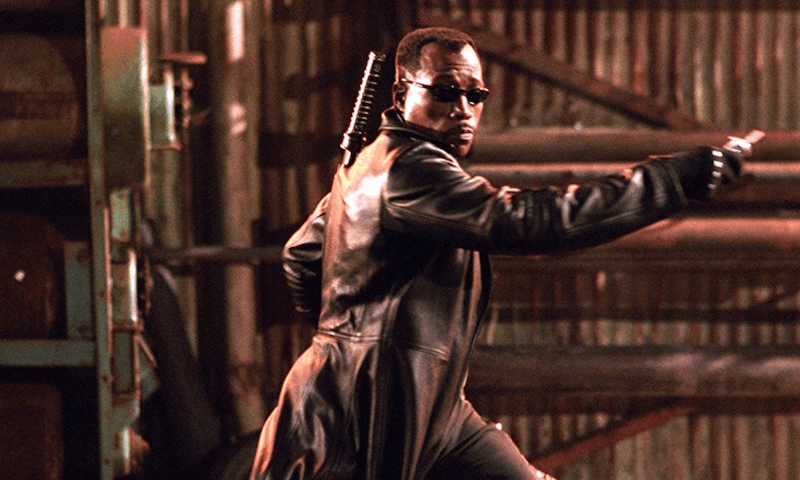 Wesley Snipes wearing a leather jacket and carrying a weapon on 'Blade: Trinity'. 