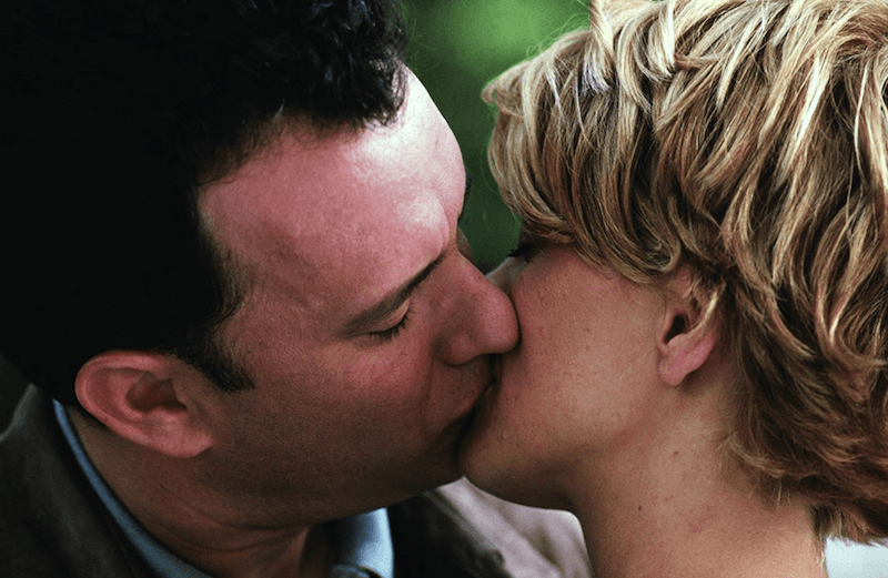 Meg Ryan and Tom Hanks kiss in 'You've Got Mail'. 