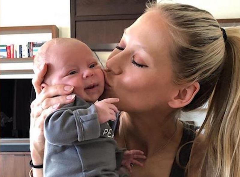 Anna Kournikova kisses her baby on the cheek Anna Kournikova kisses her baby on the cheek