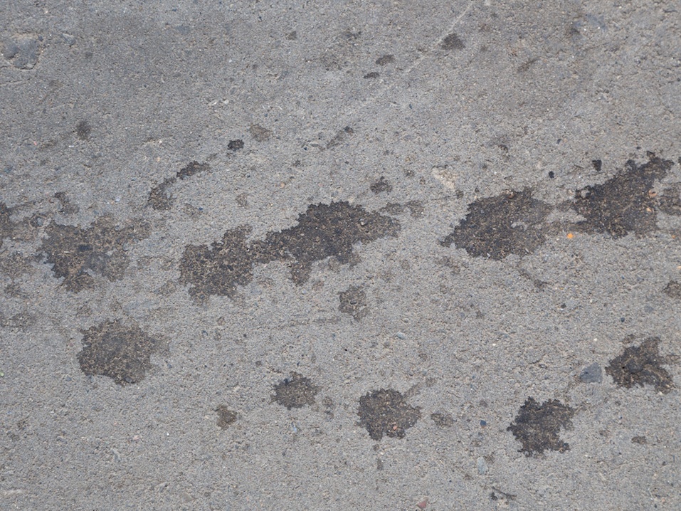 Asphalt with dark spots
