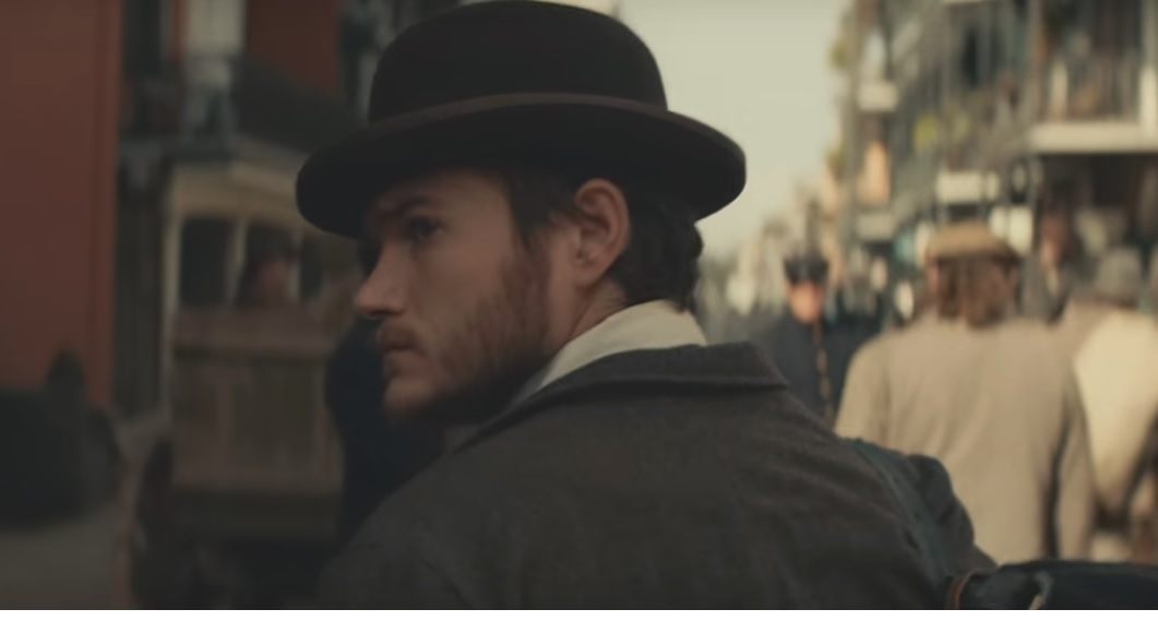 A young immigrant wearing a bowler hat.