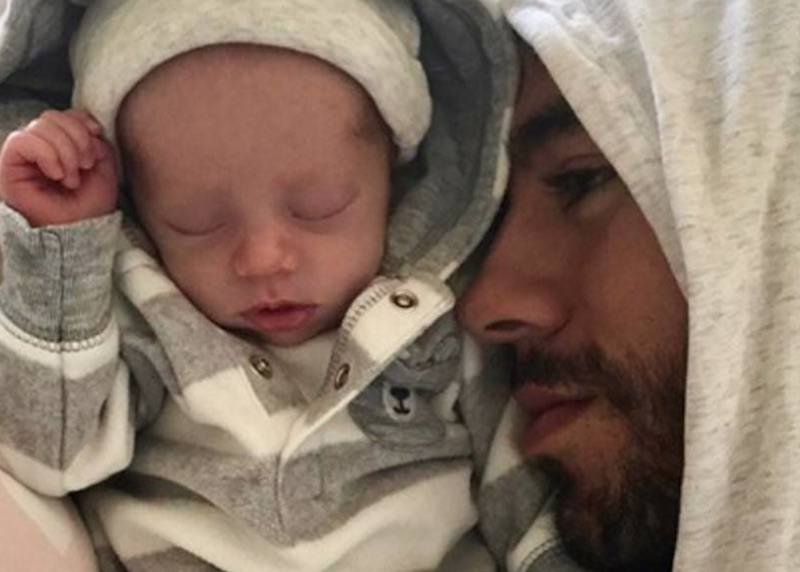 Enrique Iglesias cuddles with his newborn Enrique Iglesias cuddles with his newborn
