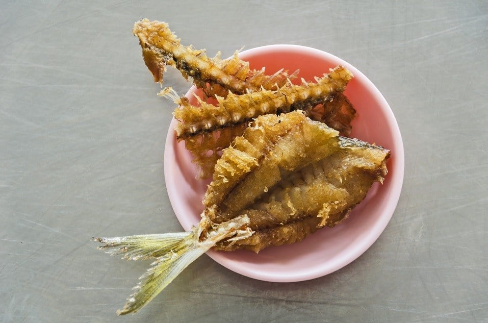 fish fried on cup and table