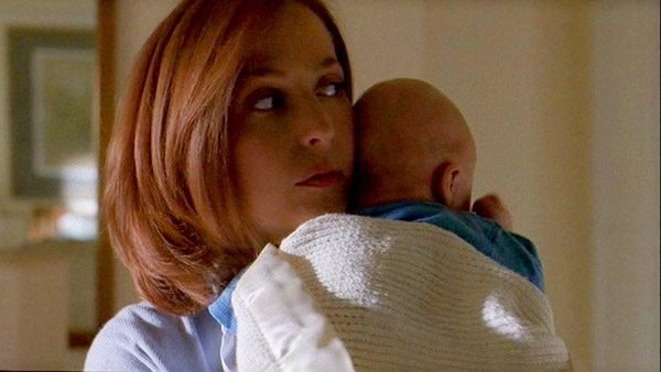 Scully holds a baby on the X-files Scully holds a baby on the X-files