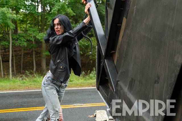 Jessica Jones lifting up a car Jessica Jones lifting up a car