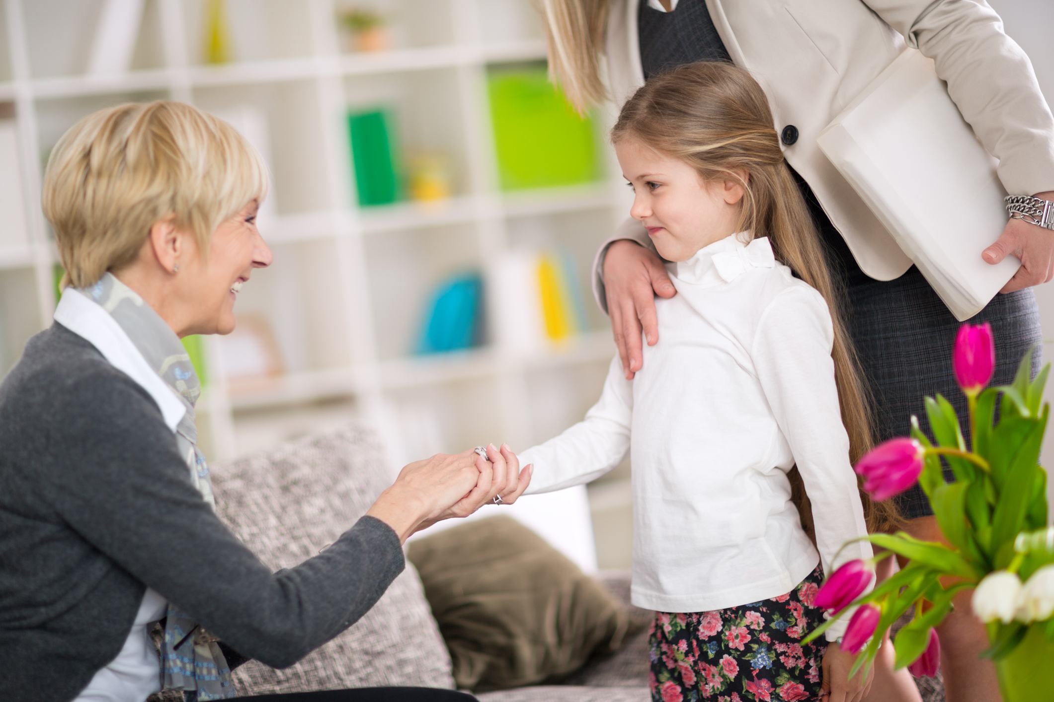 Little girl with her mature babysitter or nanny