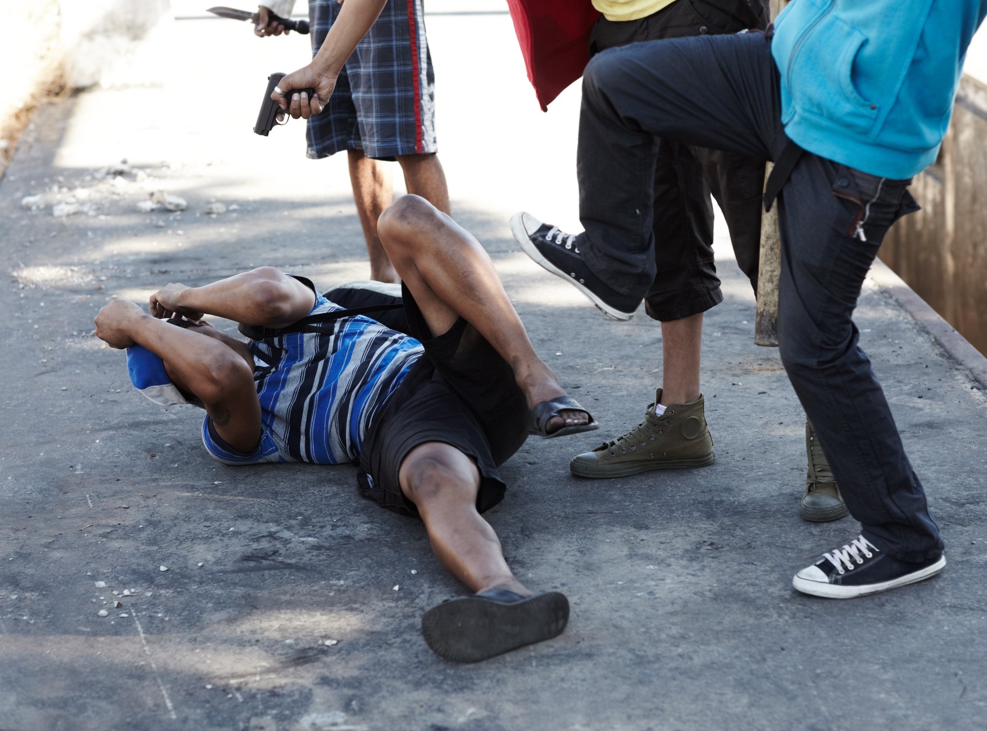 Physical assault by a group of men