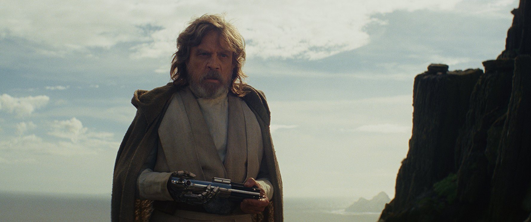 Luke Skywalker in 'Star Wars: The Last Jedi' holding a lightsaber