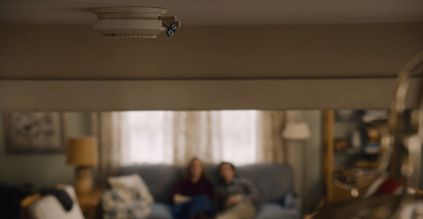 In 'This is Us,' Jack and Rebecca's smoke detector hangs without batteries as they sit and talk on their couch in the background. 