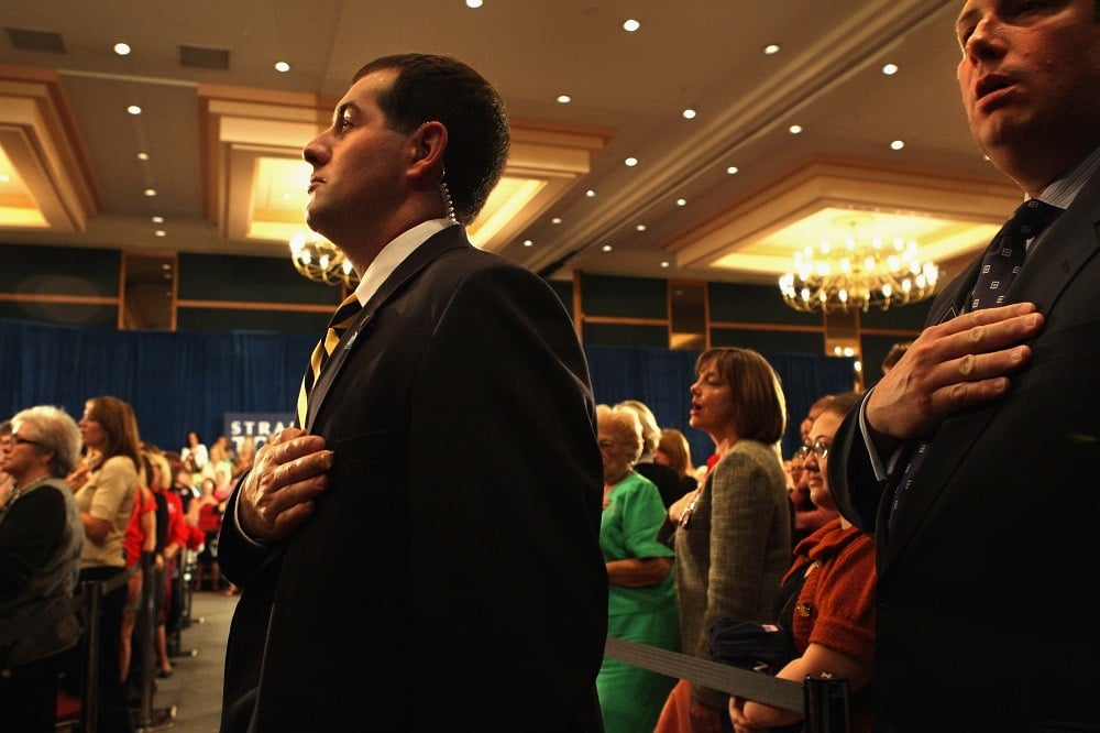 A Secret Service agent recites the Pledge of Allegiance