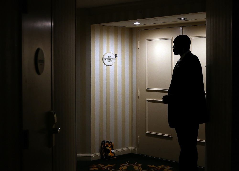 A U.S. Secret Service agent stands guard in front of the hotel room