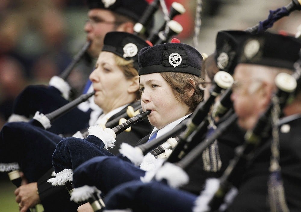 young girl plays the bagpipes