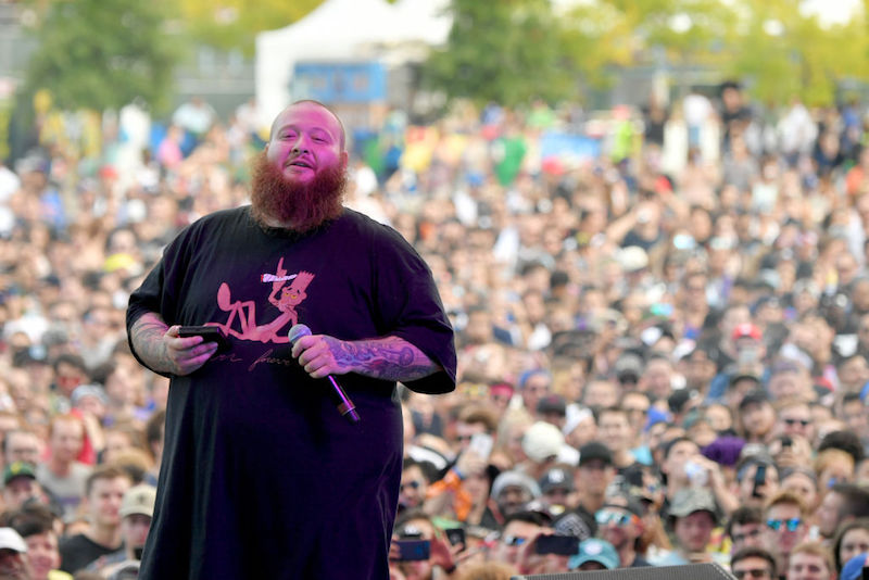 Action Bronson in front of a large audience. Action Bronson in front of a large audience.