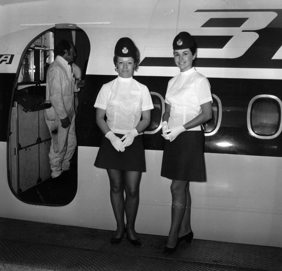 Air hostesses at work just before welcoming boarding passengers