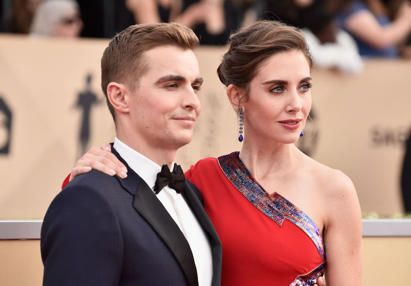 Alison Brie wraps her arm around Dave Franco. Alison Brie wraps her arm around Dave Franco.