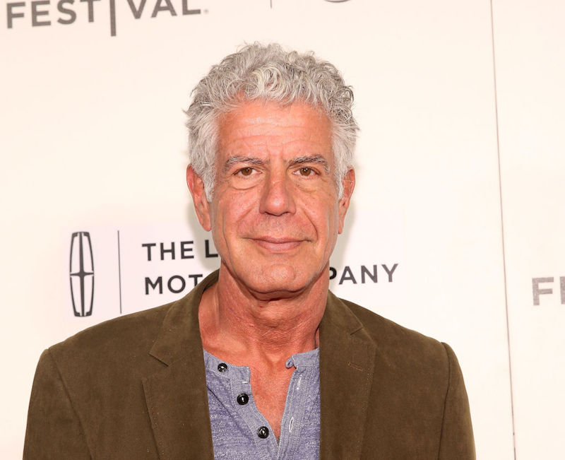 Anthony Bourdain wearing a brown jacket and gray shirt. Anthony Bourdain wearing a brown jacket and gray shirt.