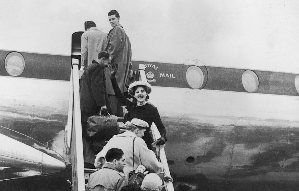 Passengers board BOAC's new Britannia propeller-turbine airliner G-ANBI at London Airport
