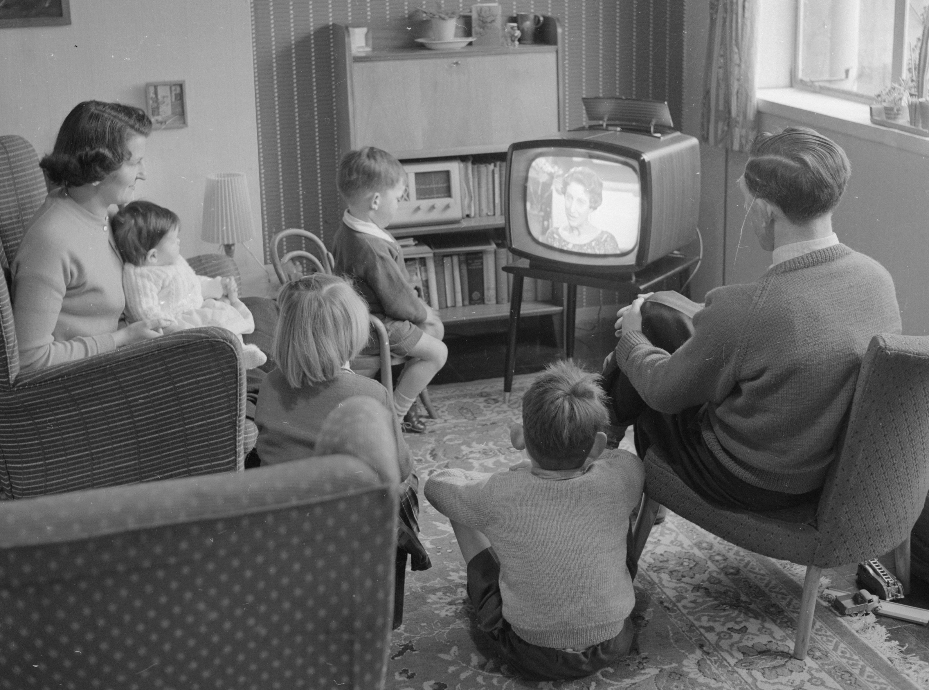 Baby boomers in the 1950s watching TV