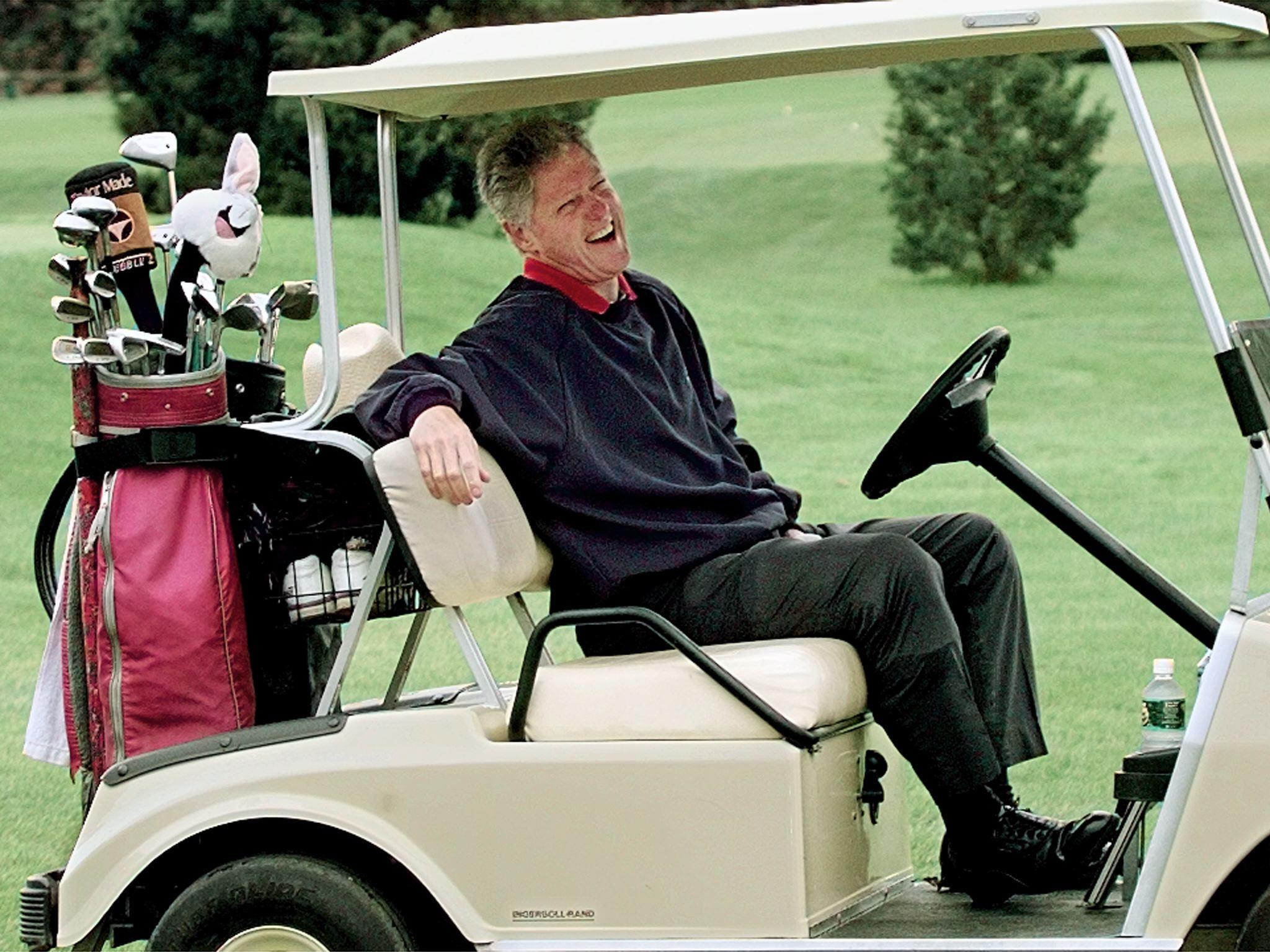 US President Bill Clinton golfing