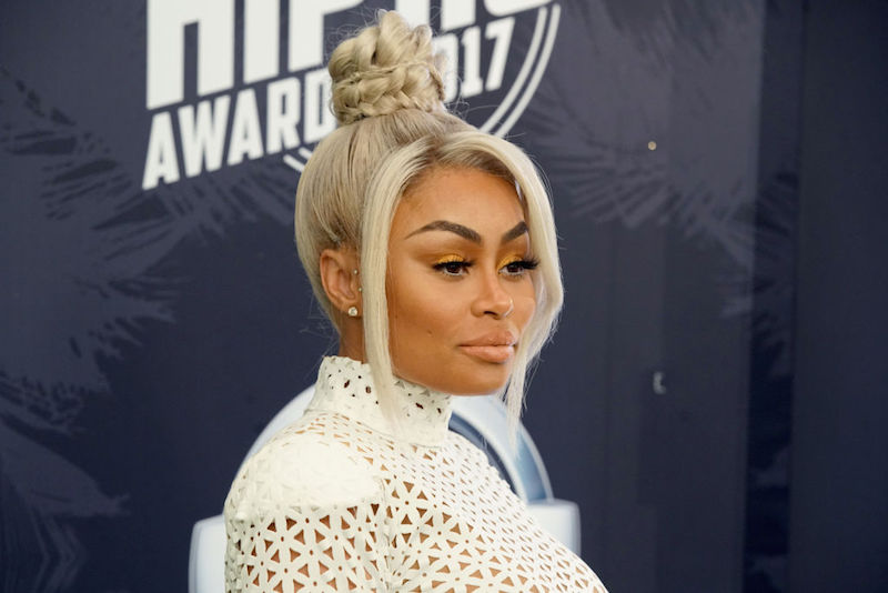 Blac Chyna posing on a red carpet. Blac Chyna posing on a red carpet.