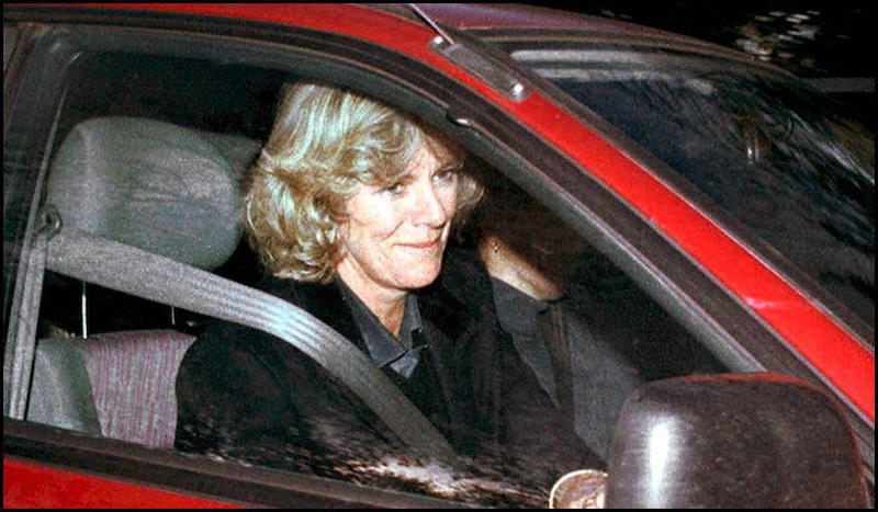Camilla Parker Bowles inside a red car.