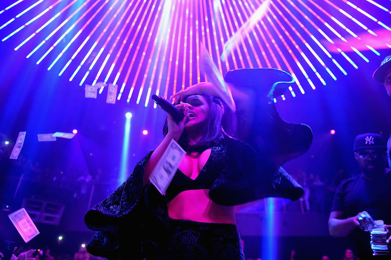 Cardi B performing on stage. Cardi B performing on stage.
