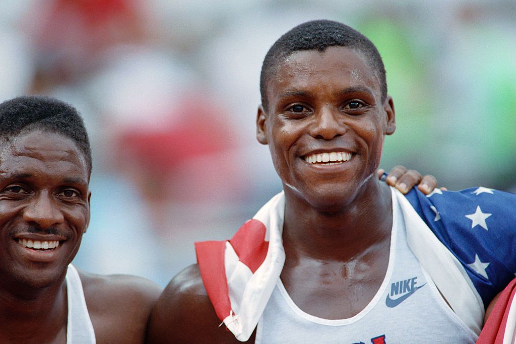 Carl Lewis of the USA smiles after winning