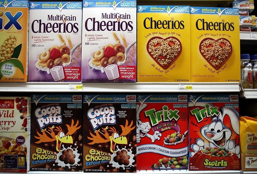Breakfast cereals lined up on a shelf. Breakfast cereals lined up on a shelf.