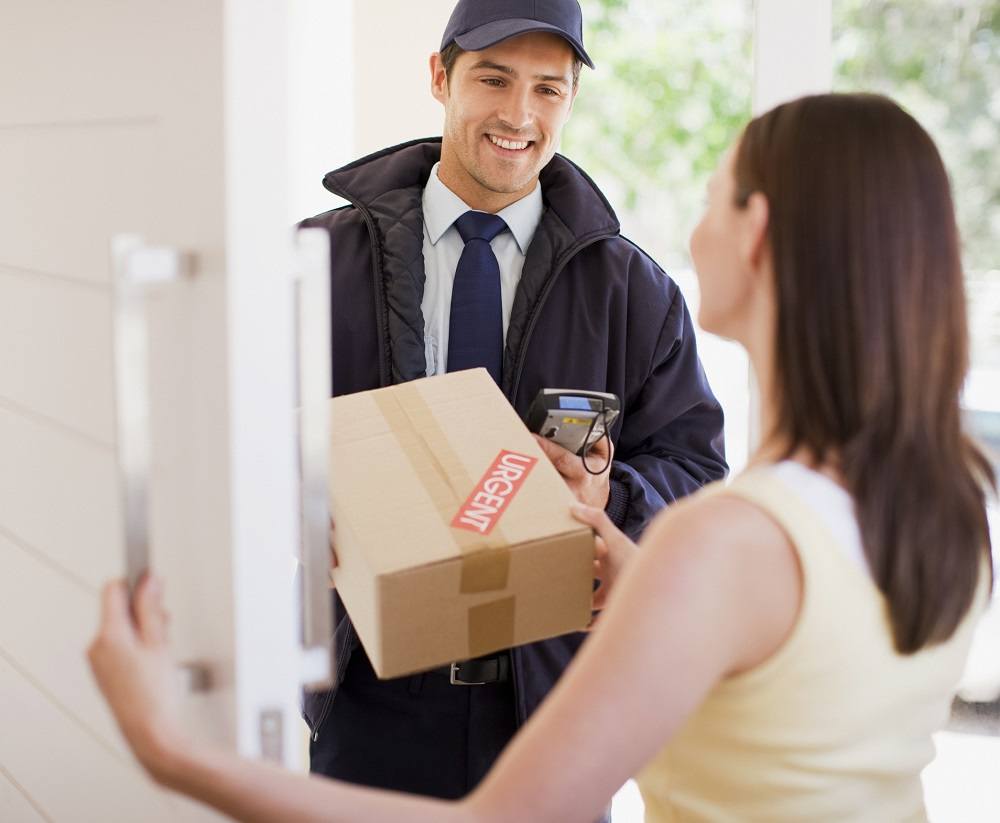 Delivery man handing box