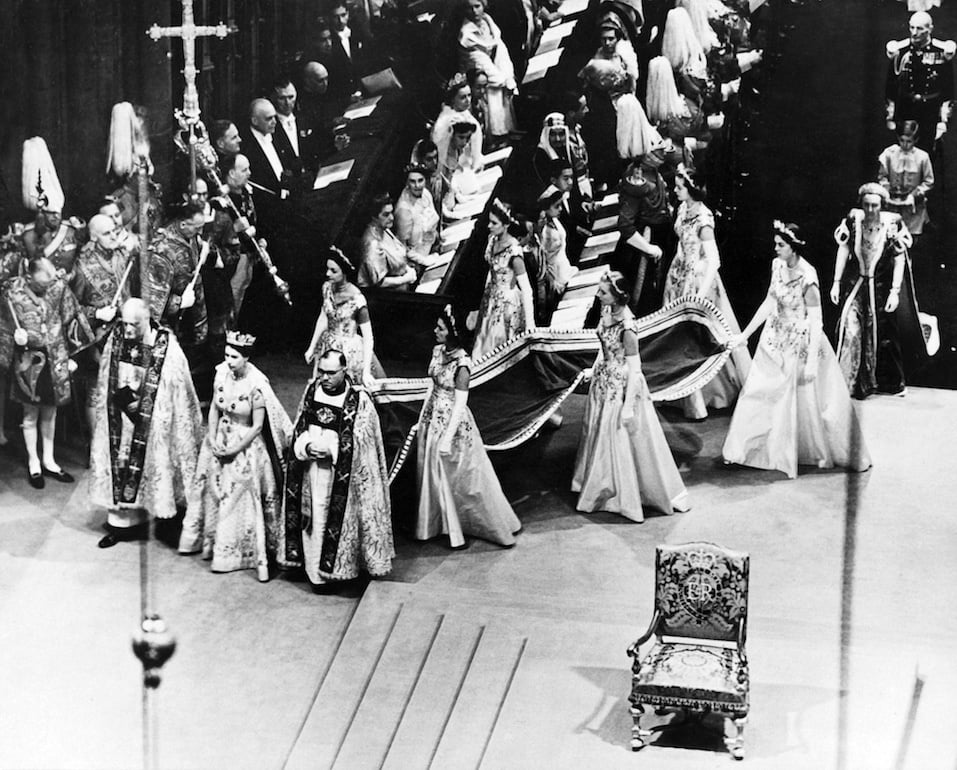 Queen Elizabeth II, surrounded by the bishop of Durham Lord Michael Ramsay nd the bishop of Bath and Wells Lord Harold Bradfield, walks to the altar