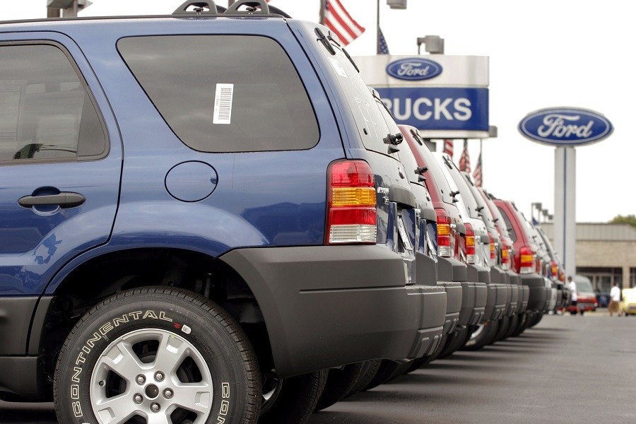 Ford SUV's sit on a Ford dealership
