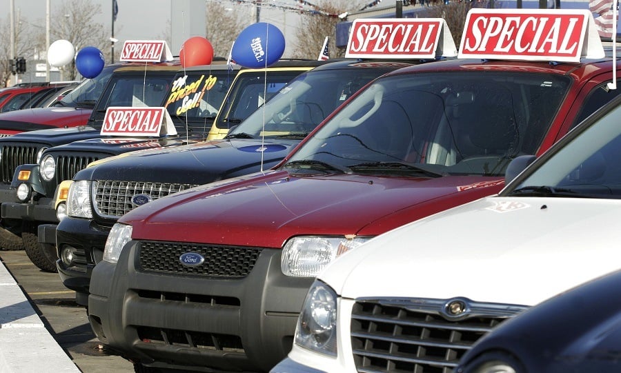 Used Ford vehicles sit at a Ford dealership