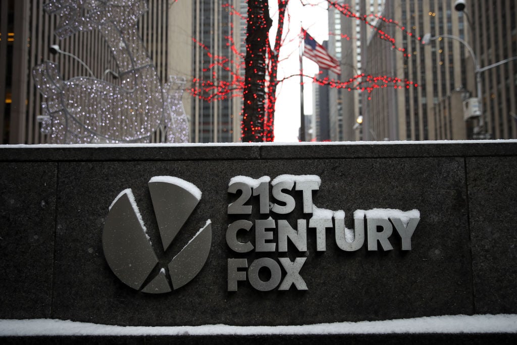 Signage for 21st Century Fox stands outside