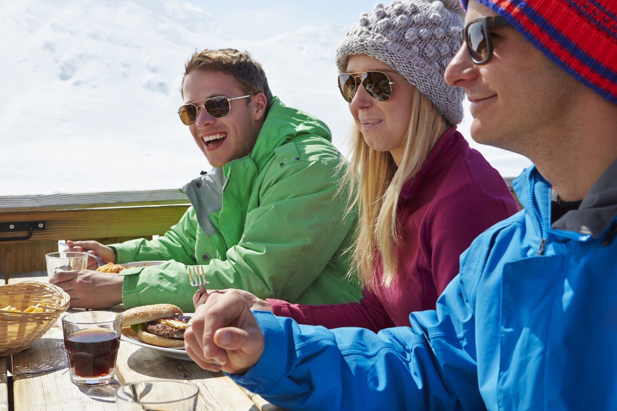 Friends eating at mountain ski restaurant