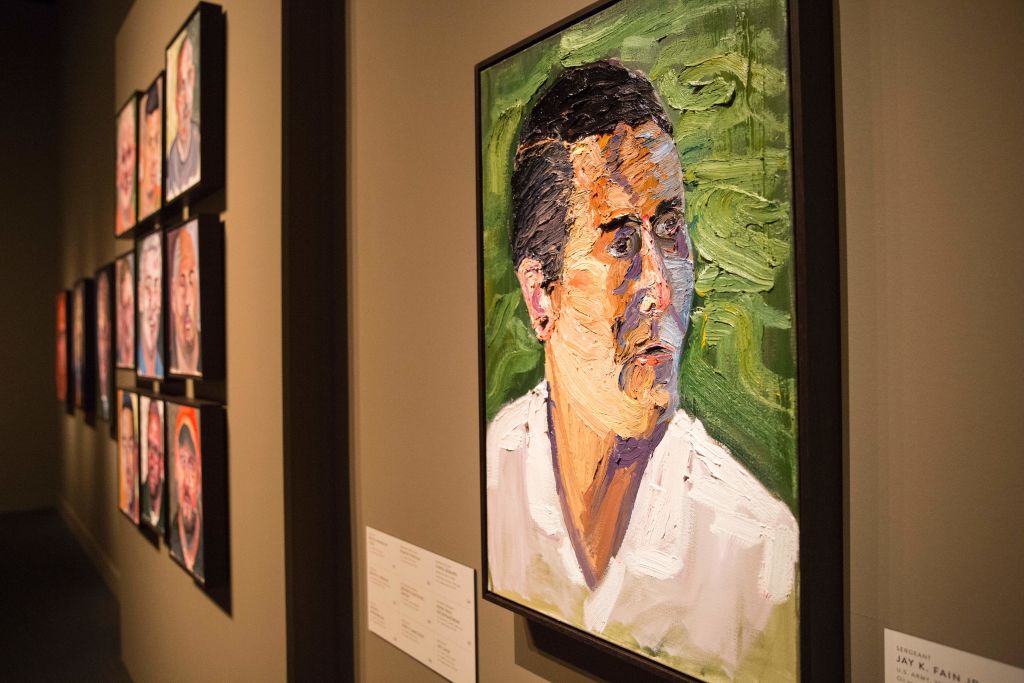 Paintings of wounded US military veterans painted by former US President George W. Bush hang in "Portraits of Courage"