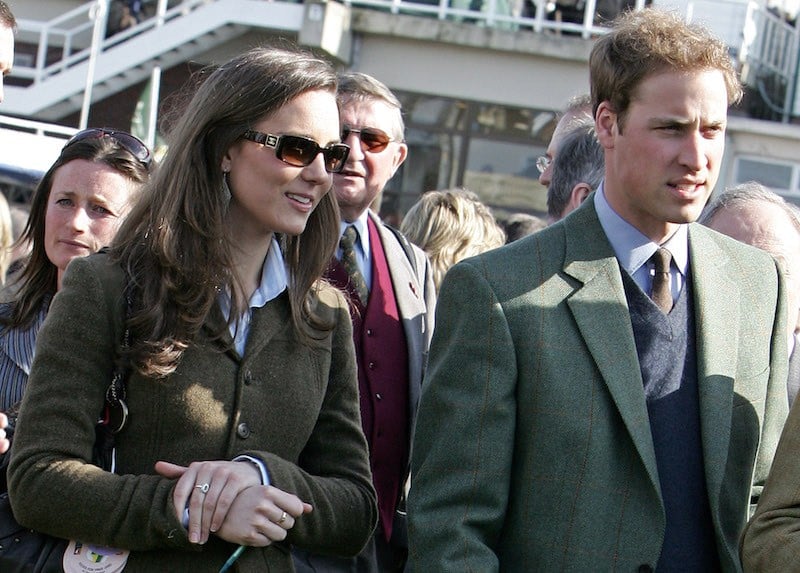 Britain's Prince William (R) stands beside girlfriend Kate Middleton (L) in the paddock enclosure on the first day of the Cheltenham Race Festival at Cheltenham Race course, in Gloucestershire 13 March 2007. (Photo credit should read CARL DE SOUZA/AFP/Getty Images)