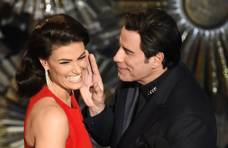 John Travolta (R) and Idina Menzel present an award on stage at the 87th Oscars February 22, 2015 in Hollywood, California. AFP PHOTO / Robyn BECK / AFP PHOTO / ROBYN BECK (Photo credit should read ROBYN BECK/AFP/Getty Images)