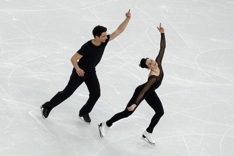 Canada's Olympic ice dance champions Scott Moir and Tessa Virtue perform an ice dance routine during a training session at the Iceberg Skating Palace on February 5, 2014, ahead of the 2014 Sochi Winter Olympics. The opening ceremony of the Sochi Olympic Winter will take place on February 7, 2014. AFP PHOTO/ADRIAN DENNIS (Photo credit should read ADRIAN DENNIS/AFP/Getty Images)