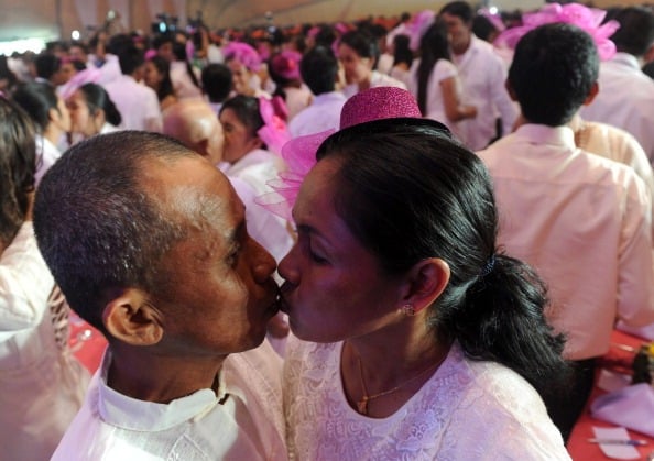 two people kiss during a mass wedding in the philippines two people kiss during a mass wedding in the philippines