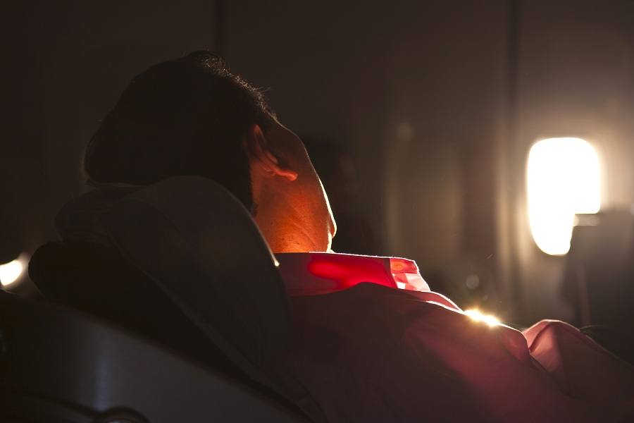 man sleeping in an aeroplane man sleeping in airplane