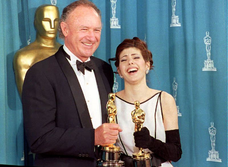 LOS ANGELES, CA - MARCH 30: U.S. actor Gene Hackman (L) and U.S. actress Marisa Tomei pose with their oscars 29 March 1993 shortly after being respectively awarded best supporting actor and best supporting actress. Hackman won for his role in "Unforgiven" and Tomei for "My Cousin Vinny." (Photo credit should read SCOTT FLYNN/AFP/Getty Images)