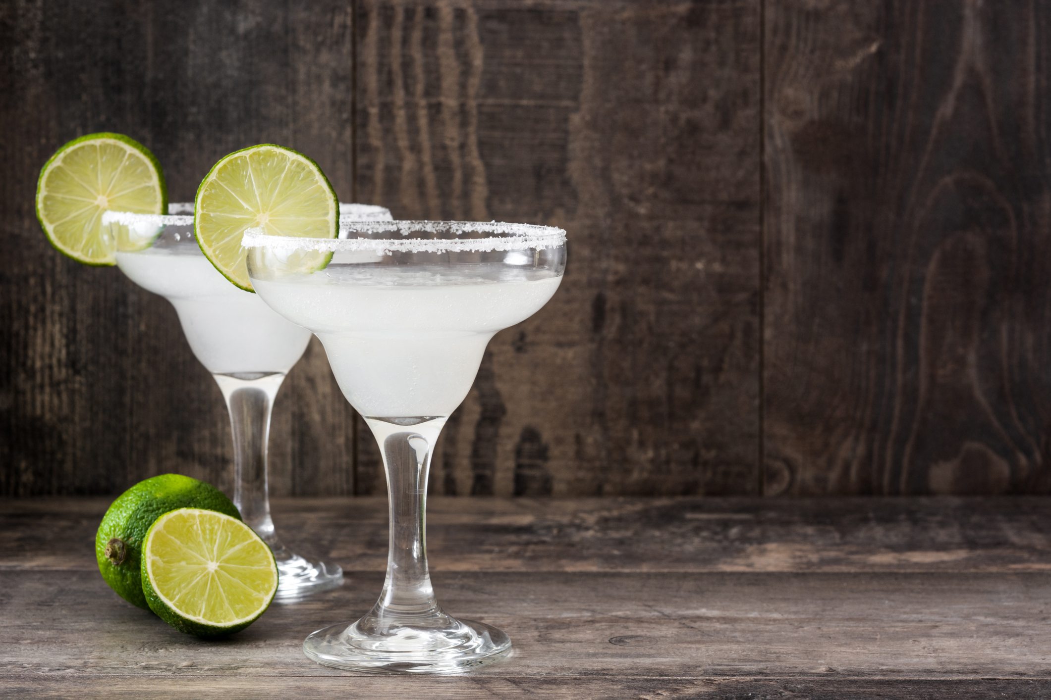 Margarita cocktail on white wooden table Margarita cocktail on white wooden table