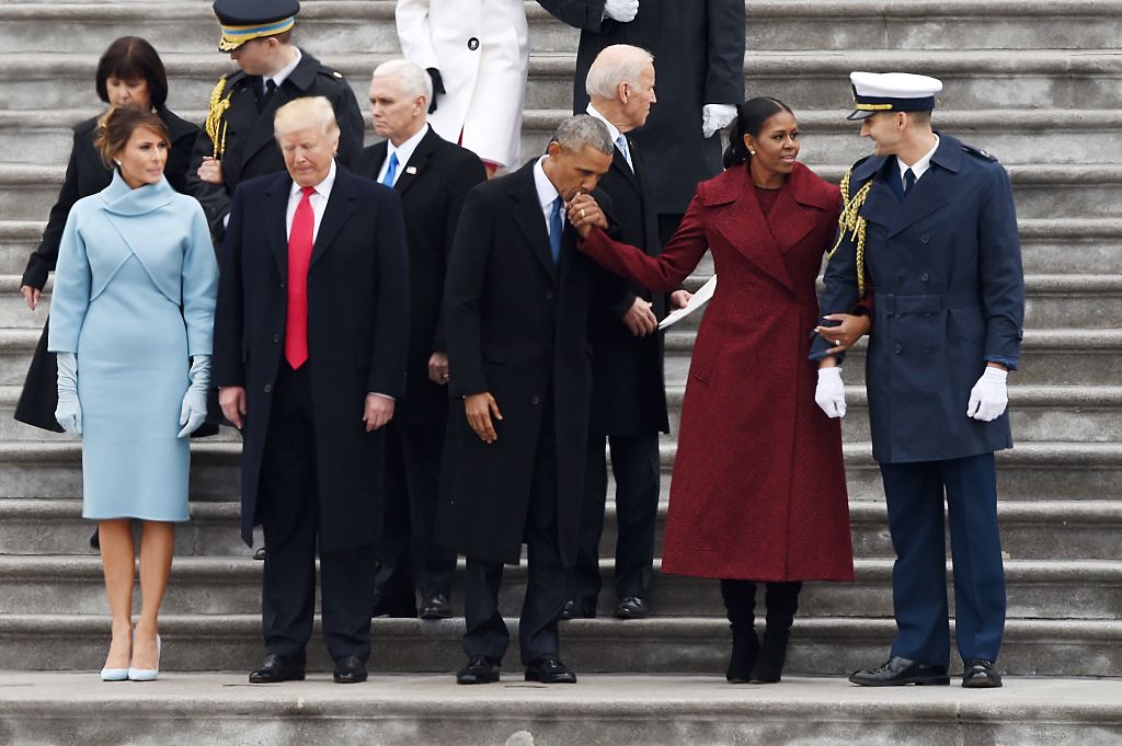 obama kisses michelle's hand with trumps next to him obama kisses michelle's hand with trumps next to him