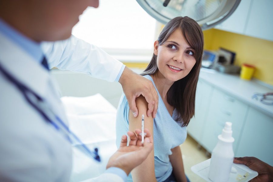Doctor giving an injection Doctor giving an injection