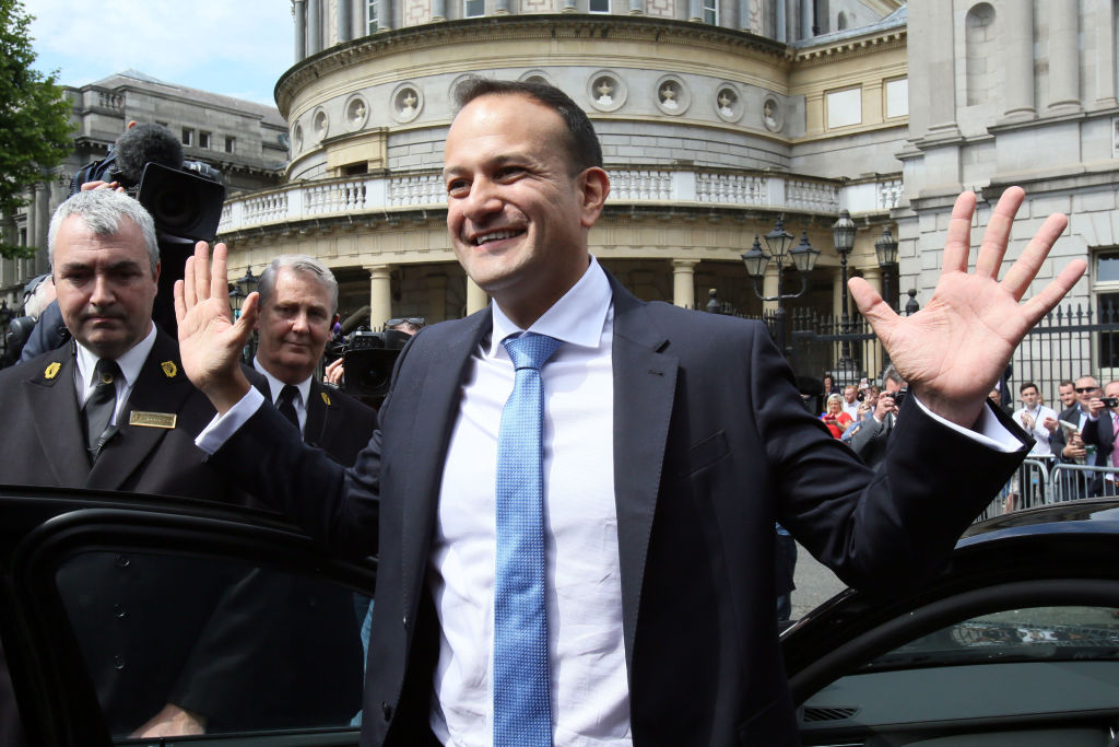 Leo Varadkar waves to colleagues as he leaves the parliament in Dublin after being confirmed as Taoiseach.