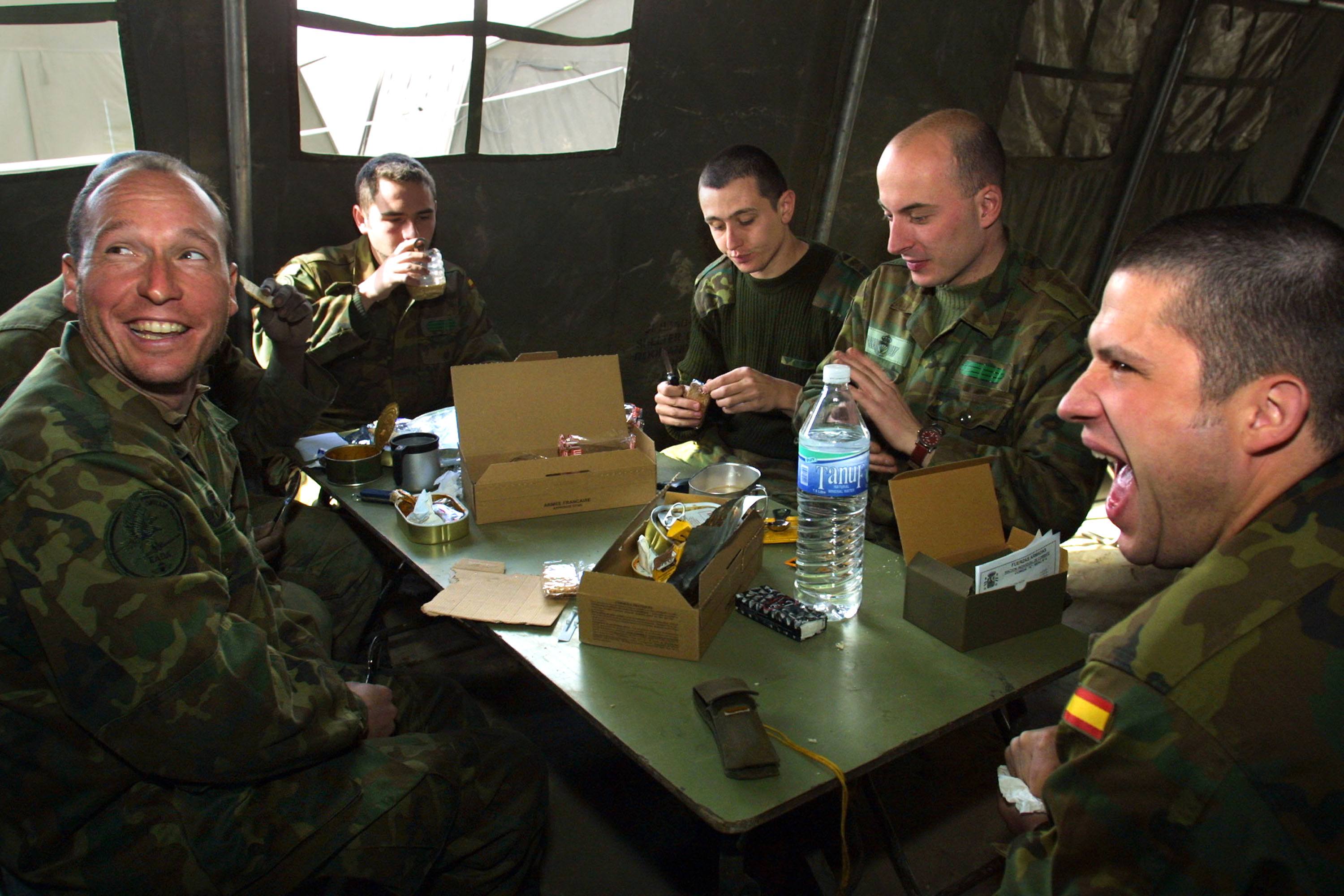 military members eat at a mess hall military members eat at a mess hall
