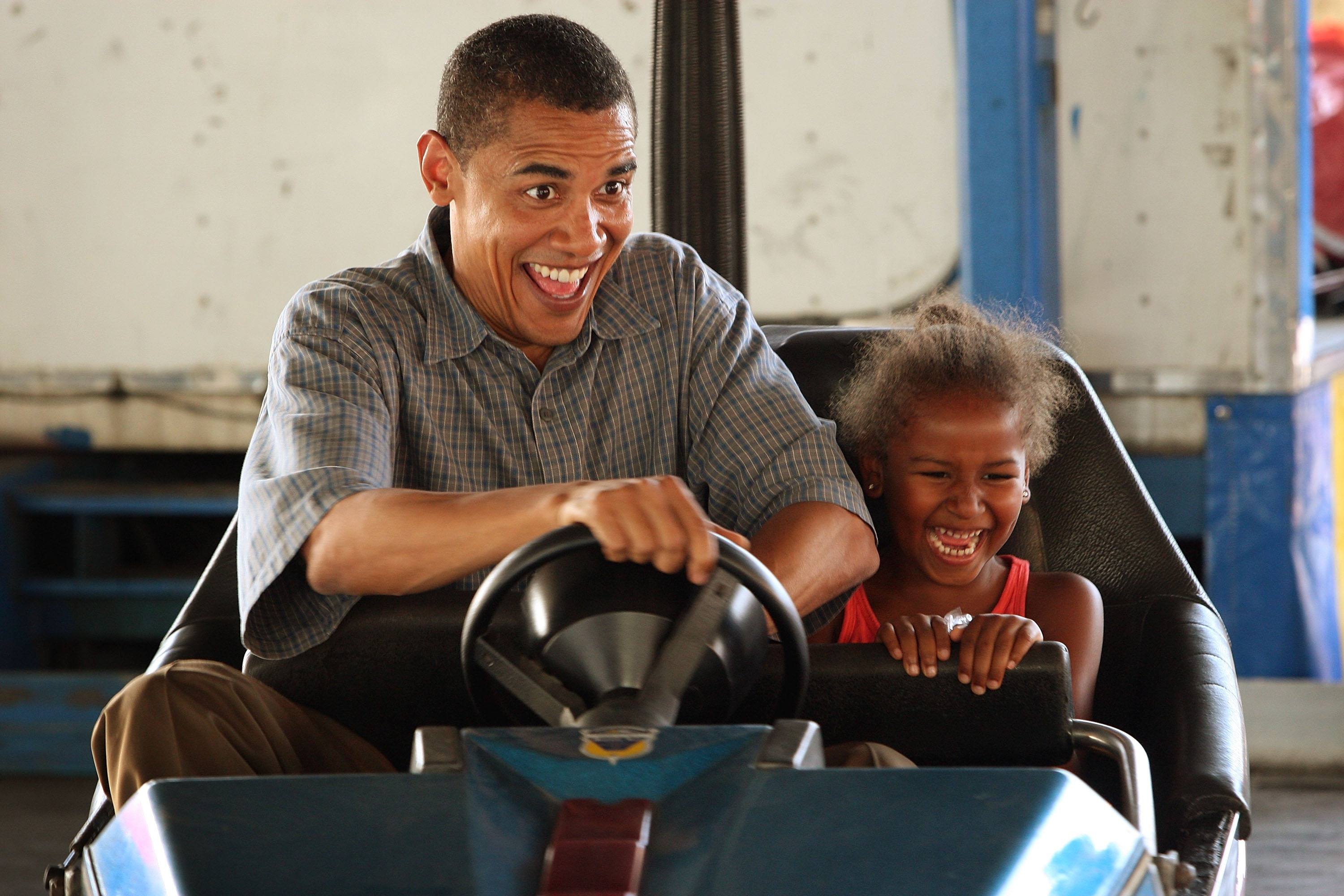 obama and sasha in a bumper car obama and sasha in a bumper car