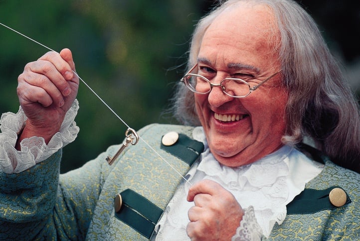 a man dressed as benjamin franklin a man dressed as benjamin franklin